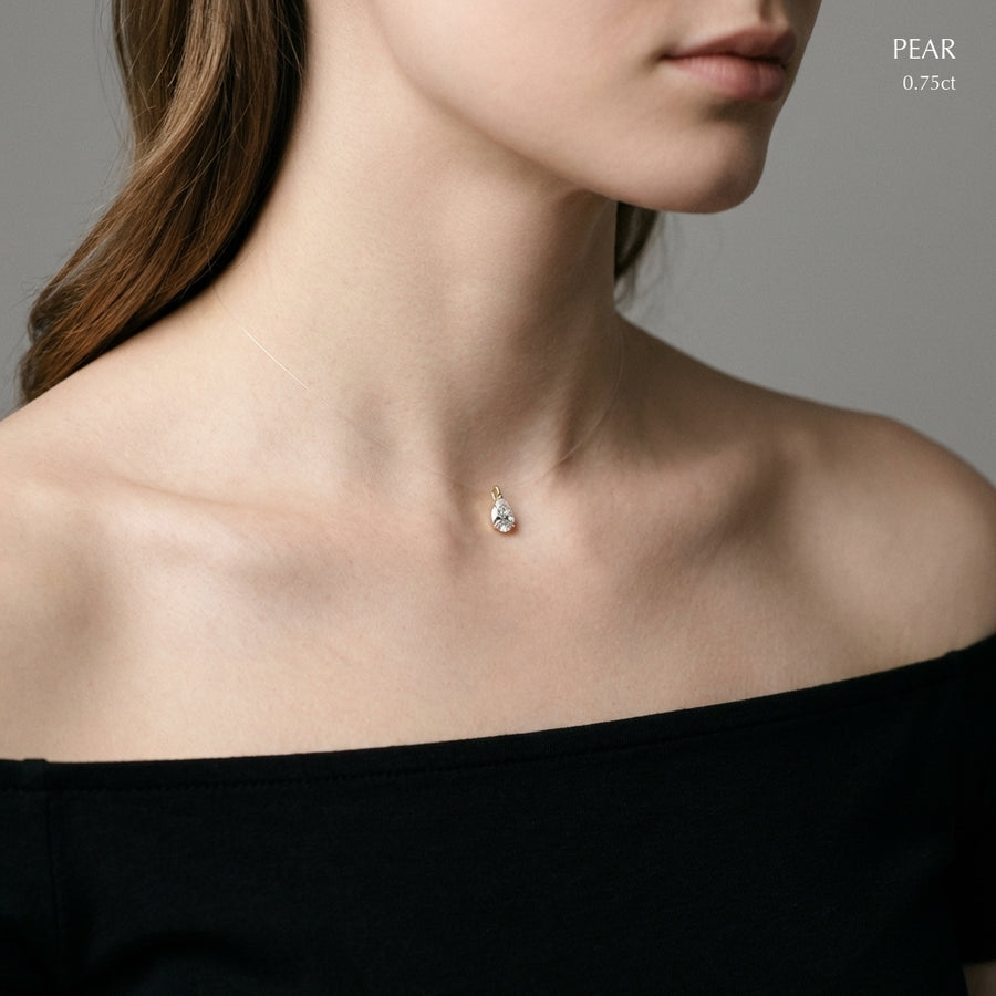Pear necklace worn on model